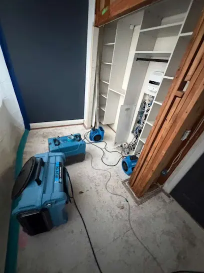 Removed flooring and air movers drying a slab after a leak in Laguna Hills