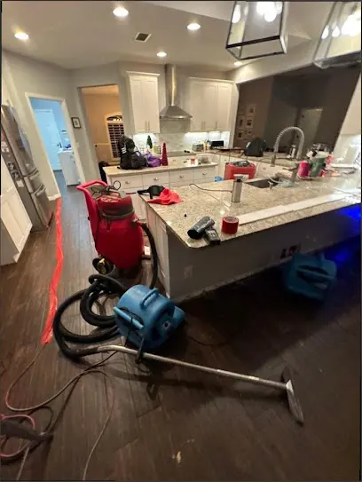 Extracting water from a Laguna Hills kitchen after a leak